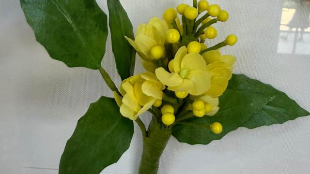 yellow paper flowers with an Oregon label below