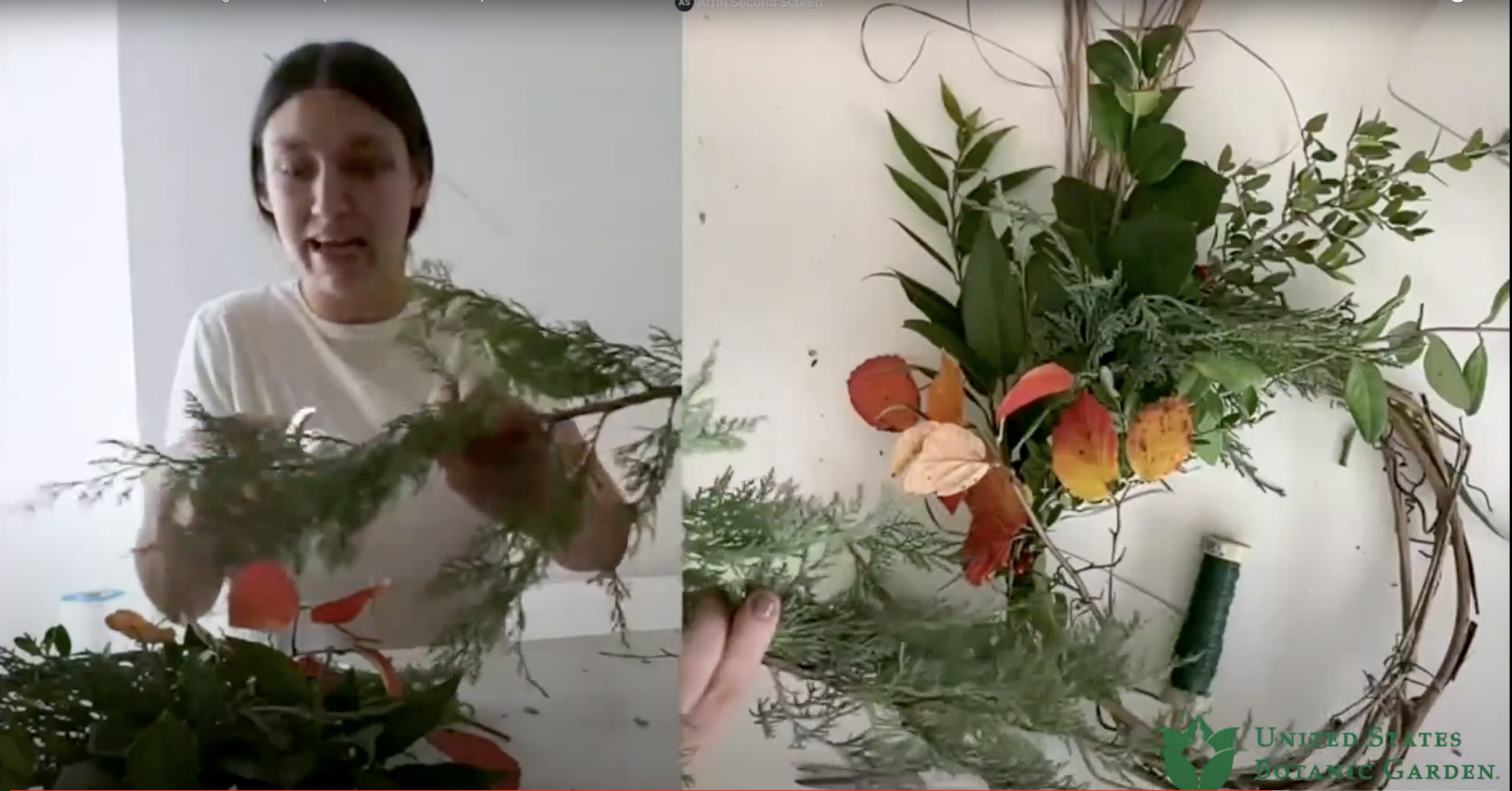 A woman holds plant cuttings, building a wreath